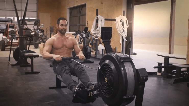 man using the concept 2 rower