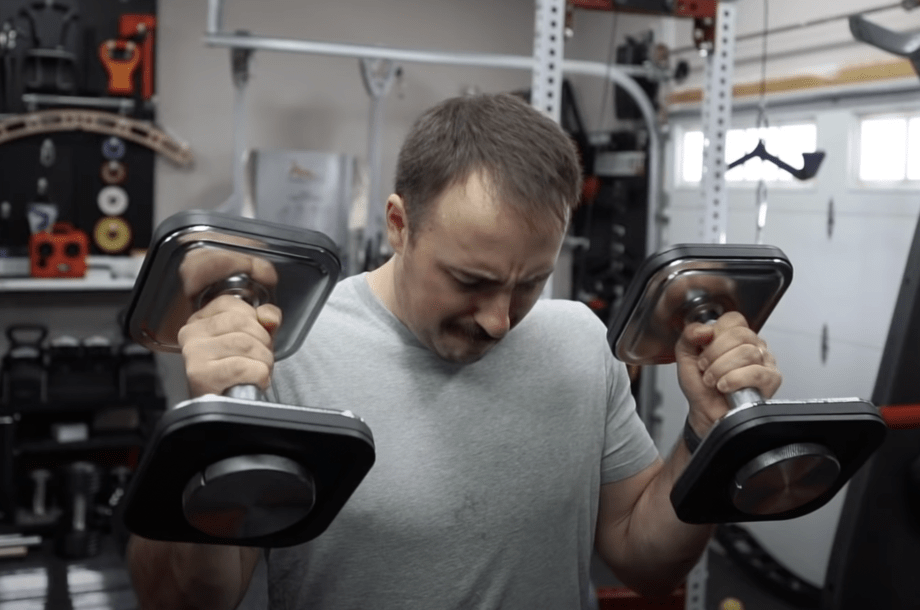 coop working out with the ironmaster adjustable dumbbells