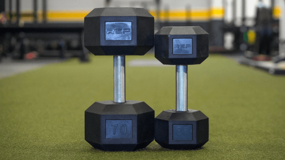 Smaller REP Fitness dumbbell next to a larger one. 