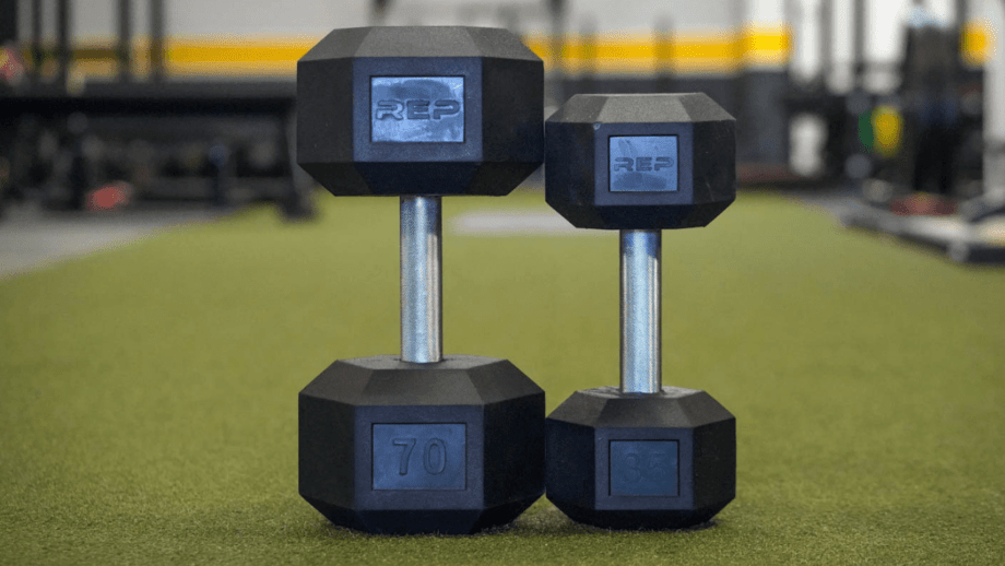 Smaller REP Fitness dumbbell next to a larger one.