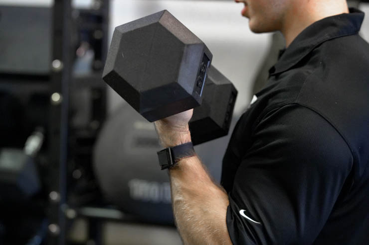 Curling with a heavier REP rubber hex dumbbell.