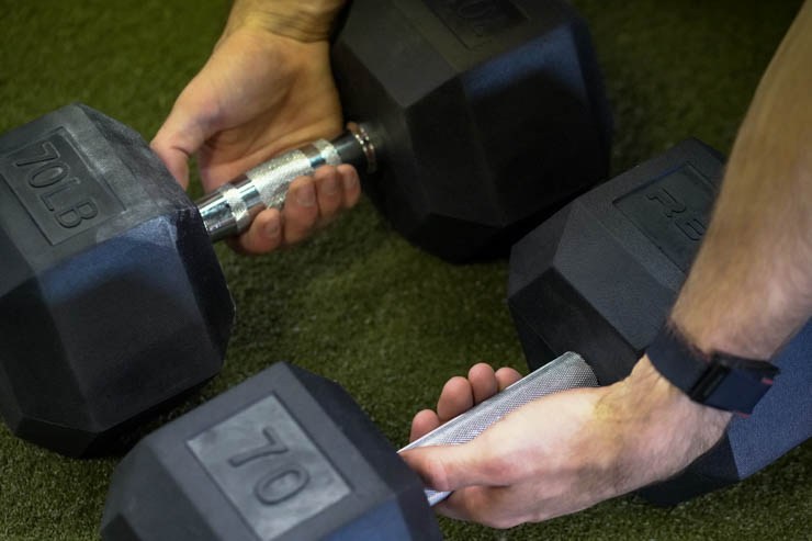 Showing the knurling of the REP Fitness Rubber Hex Dumbbells. 