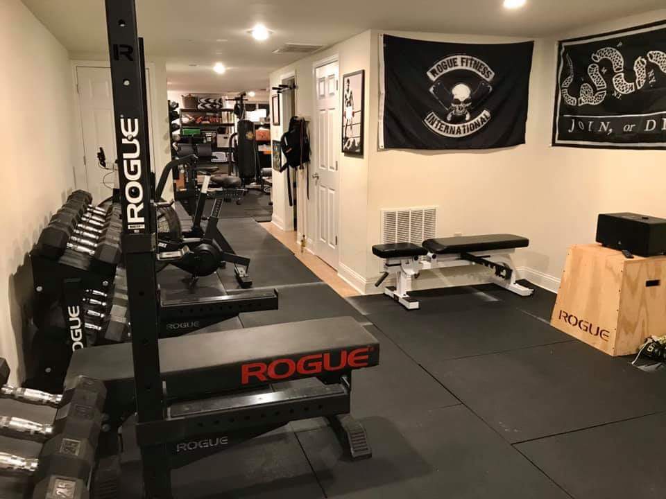 a home gym set-up with rogue fitness equipment