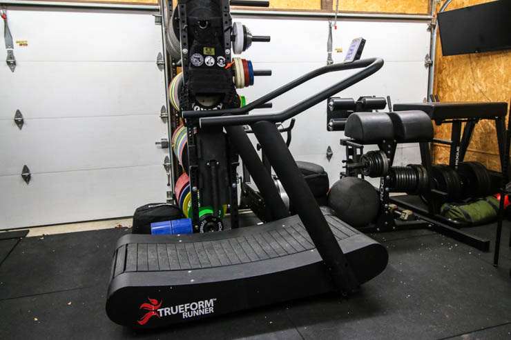 The TrueForm Runner in a home garage gym