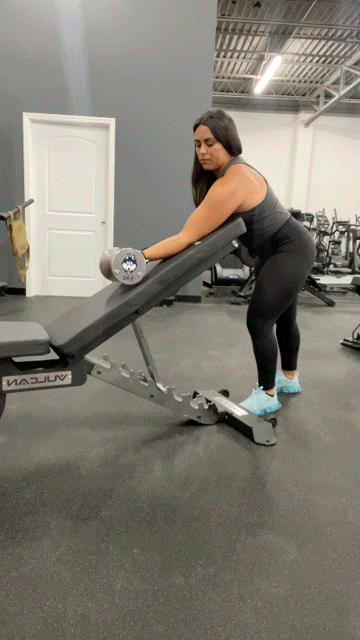 A gif of a dumbbell preacher curl
