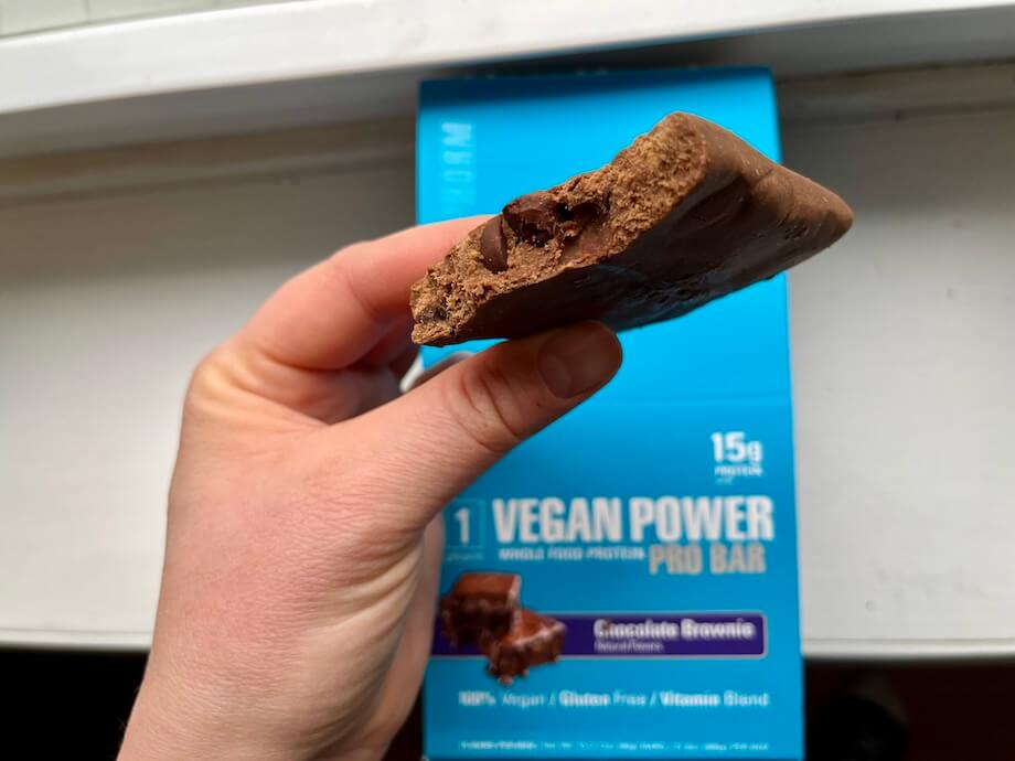An image of the Vegan Power Pro bar in someone's hand