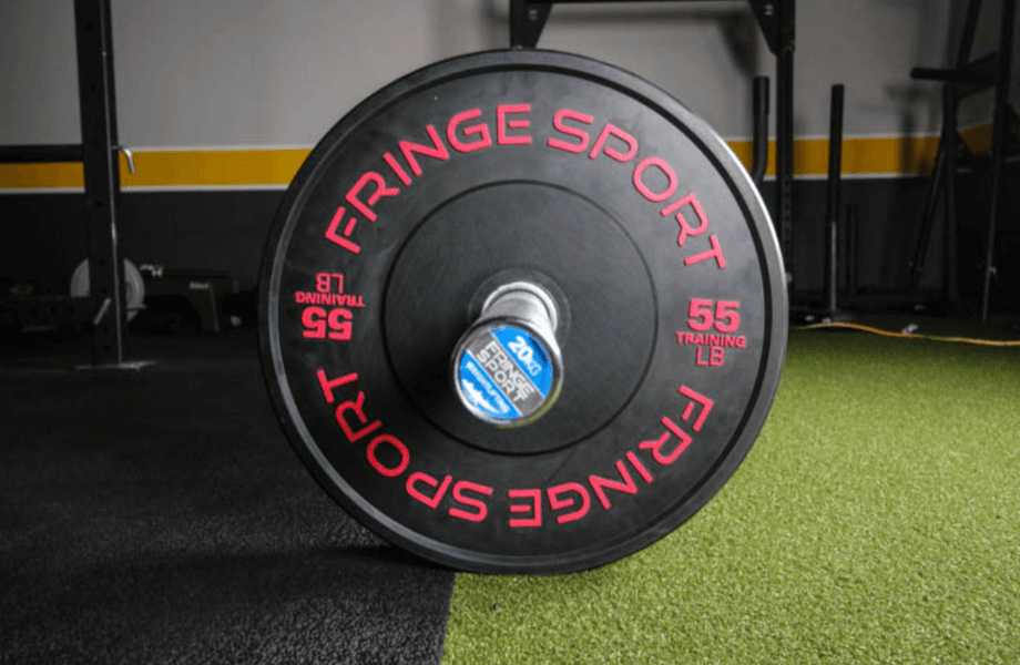 Fringe Sport Black Bumper Plate on barbell, side view