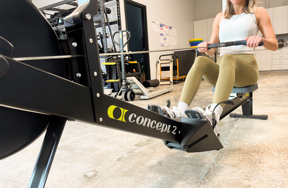A woman using the Concept2 RowErg.