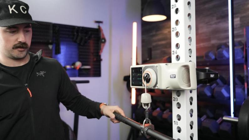 Profile view of Coop using cables on a Titan Fitness Functional Trainer