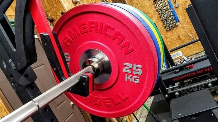 An image of the American Barbell Urethane Bumper Plates on a barbell, taken for the best weight plates roundup