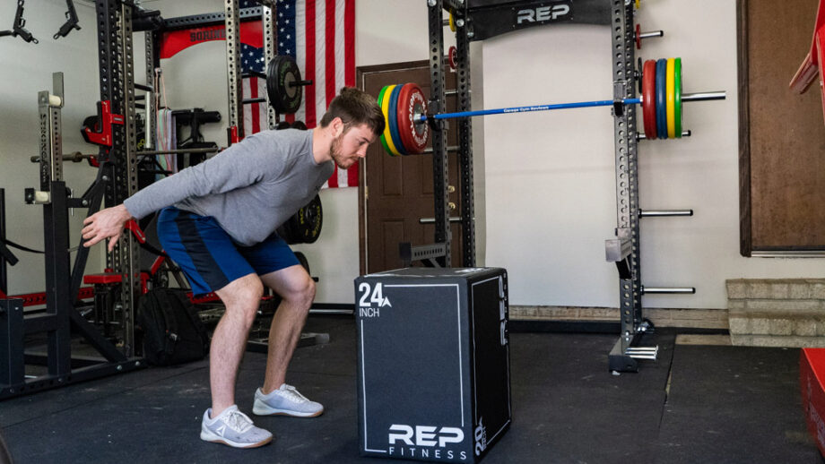 Man preparing to jump onto the REP Fitness 3-in-1 Soft Plyo Box