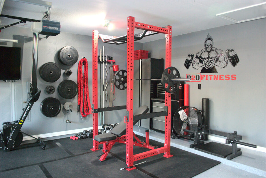 A red REP Fitness PR-4000 Power Rack set up in a garage gym