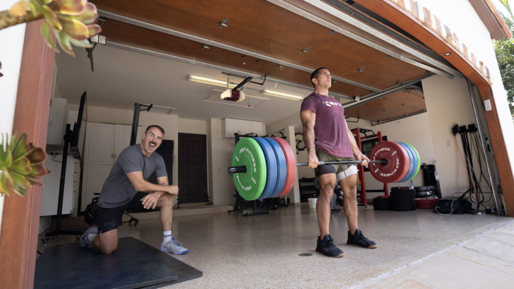 Coop hanging out at Jason Khalipa's garage gym watching Jason do deadlifts.