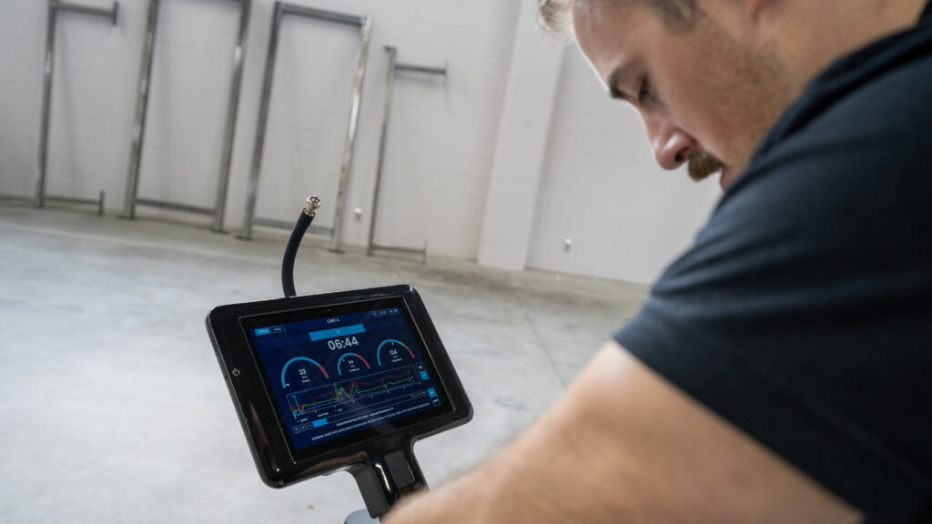 Coop using the attached screen during his ride on the CAROL Bike.