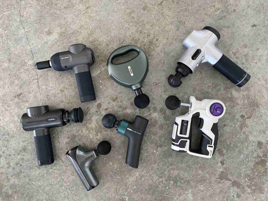 best budget massage guns cover photo - seven massage guns lying next to one another