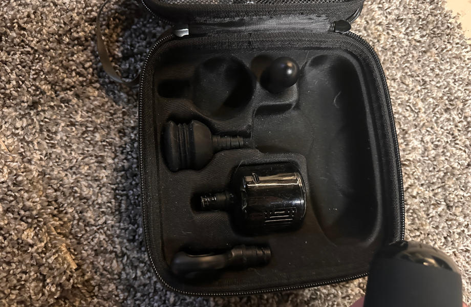 An opened case displays all of the attachments that come with the Bob & Brad Q2 Mini Pro massage gun.
