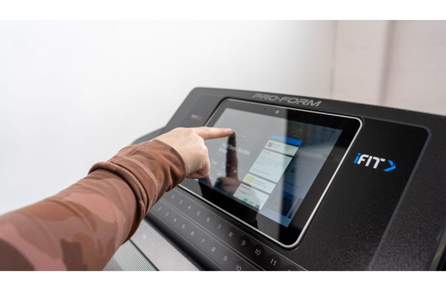 Person using the touchscreen of the Proform Carbon T10 Treadmill
