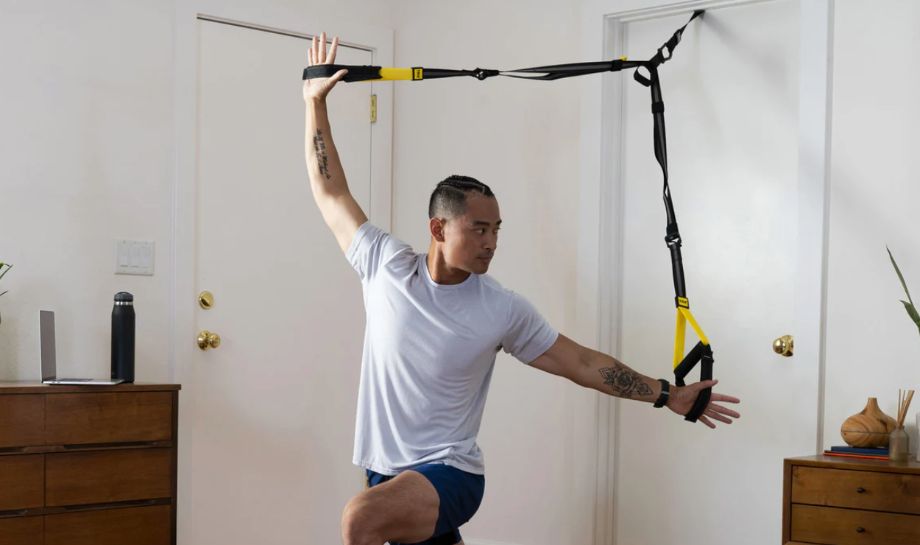 Man using TRX Suspension Trainer