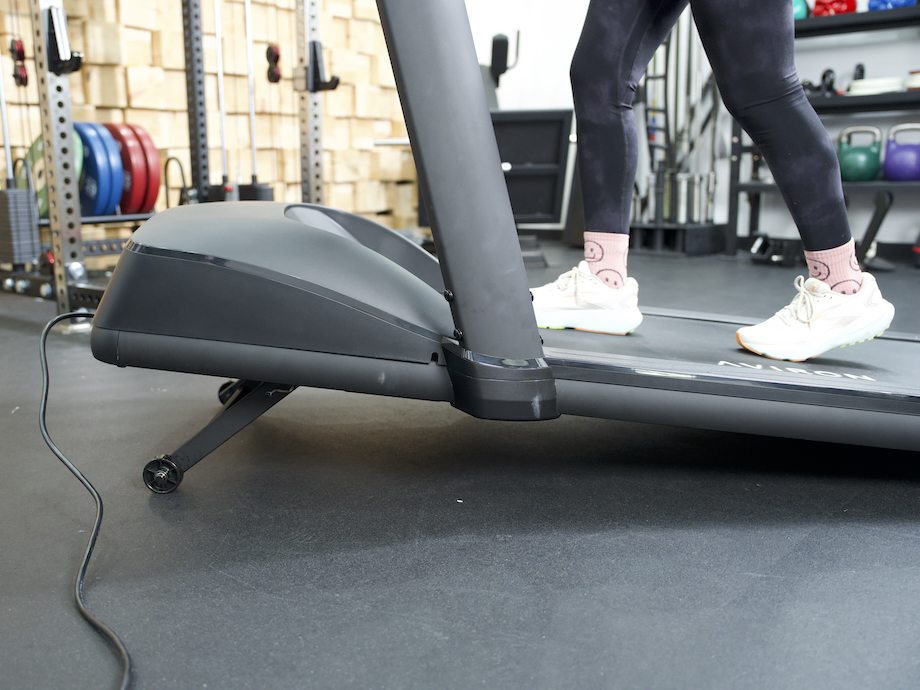 GGR product tester walking on the Aviron Victory treadmill on a slight incline