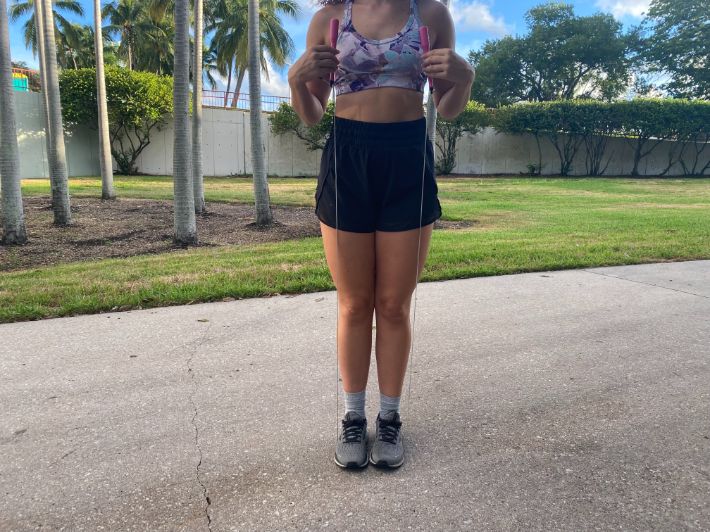 Woman sizing jump rope