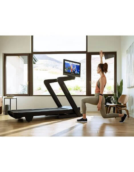 commerical 2450 treadmill woman lunging next to