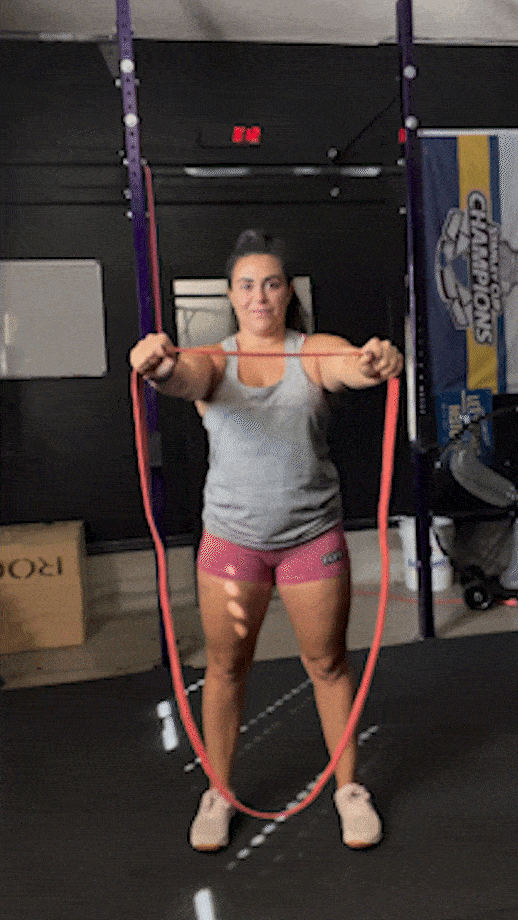 woman doing banded pull-aparts