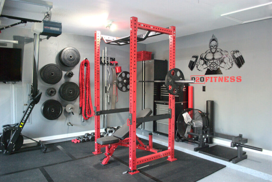 A red REP Fitness PR-4000 Power Rack set up in a garage gym