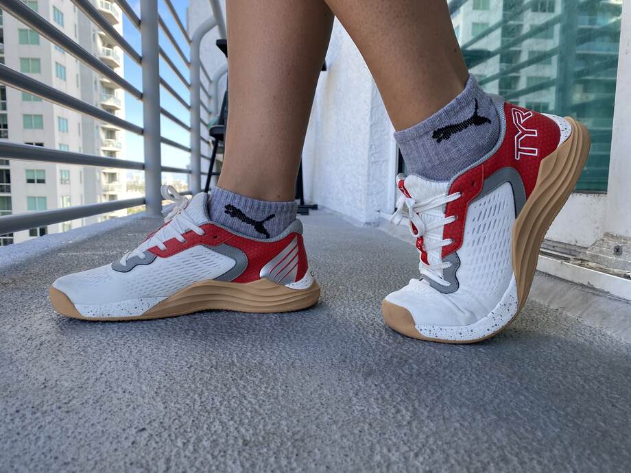 A woman poses while wearing the TYR CXT-1 Trainers