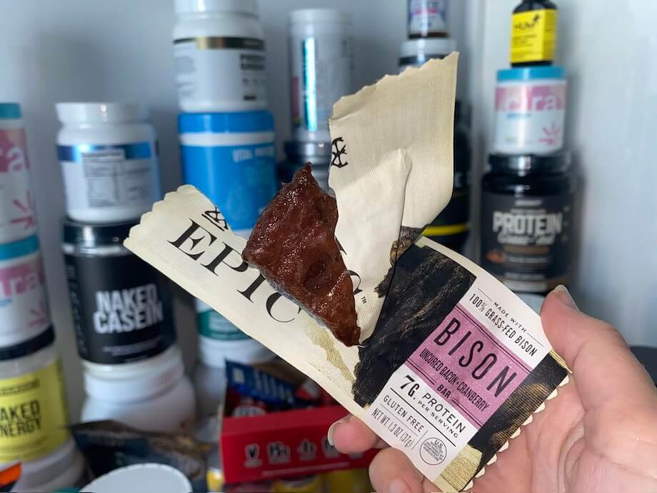 An opened EPIC Bar being held by a hand