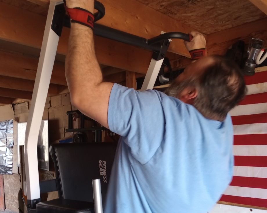 Man doing pull-ups on the Fitness Gear Pro Tower