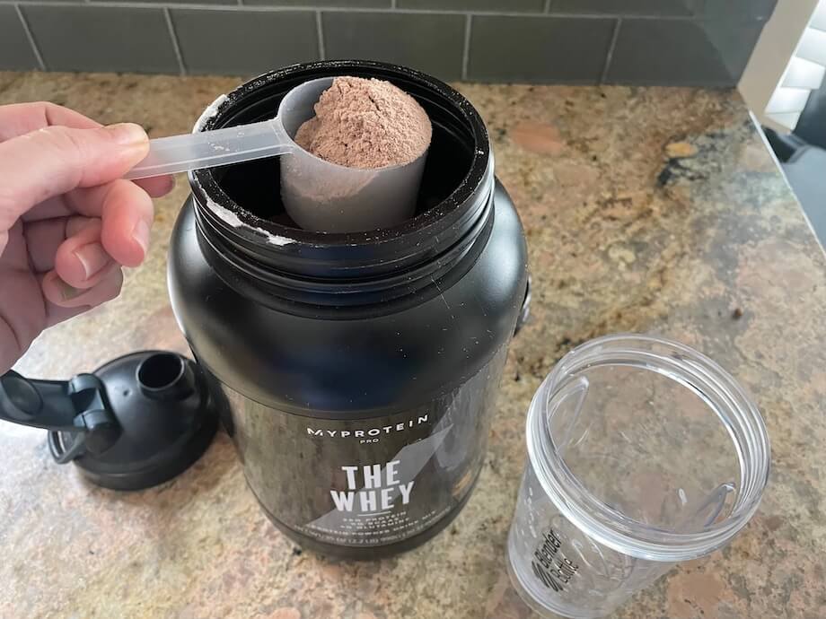 Black container of Myprotein The Whey protein powder