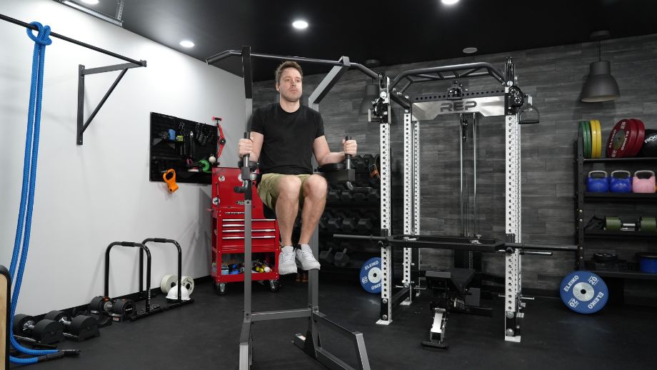 Man doing knee raises on the Proforma Power Tower