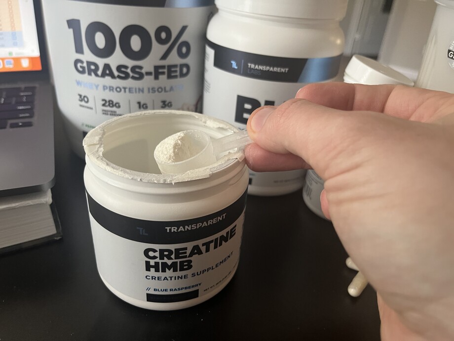A tester removes a scoop of Creatine HMB, part of their Transparent Labs Stack