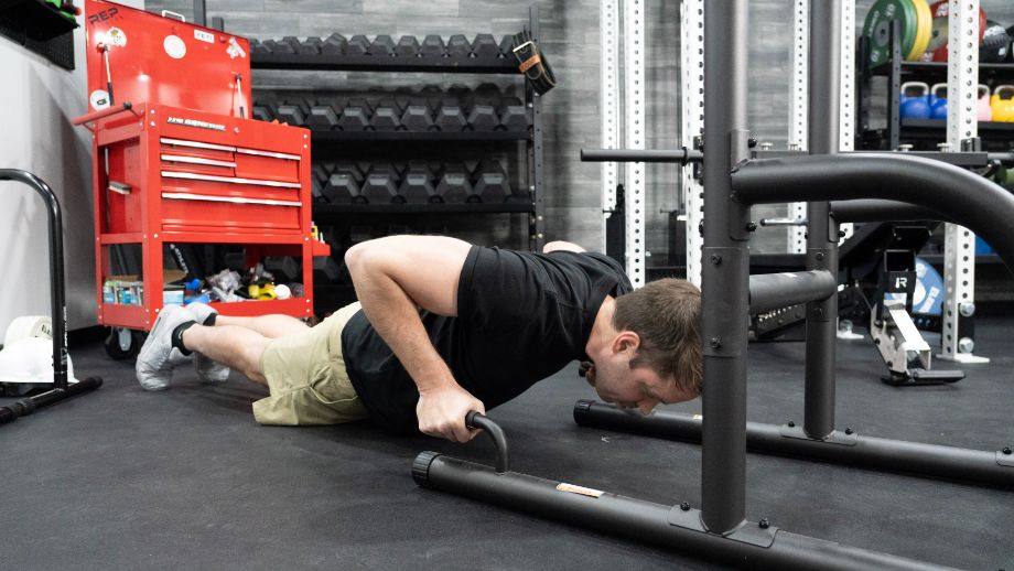 Man doing push-ups on the Weider Power Tower