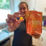 Woman Holding Create Creatine Gummies