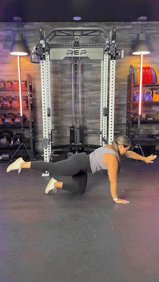 woman doing bird dog