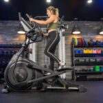 woman riding the sole e25 elliptical