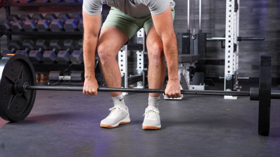 Man deadlifting with the REP Hades Bar