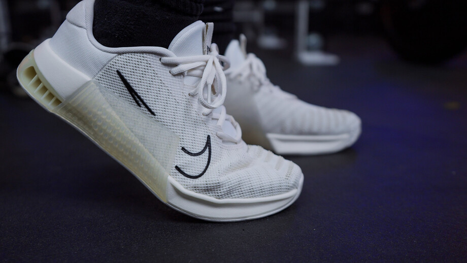 A person stepping while wearing the Nike Metcon 9