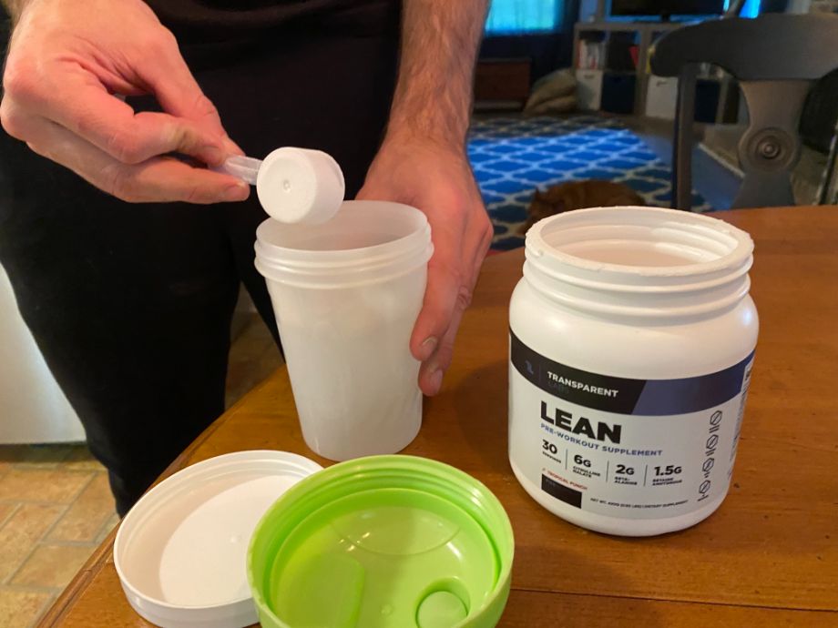 Scooping Transparent Labs Lean into bottle