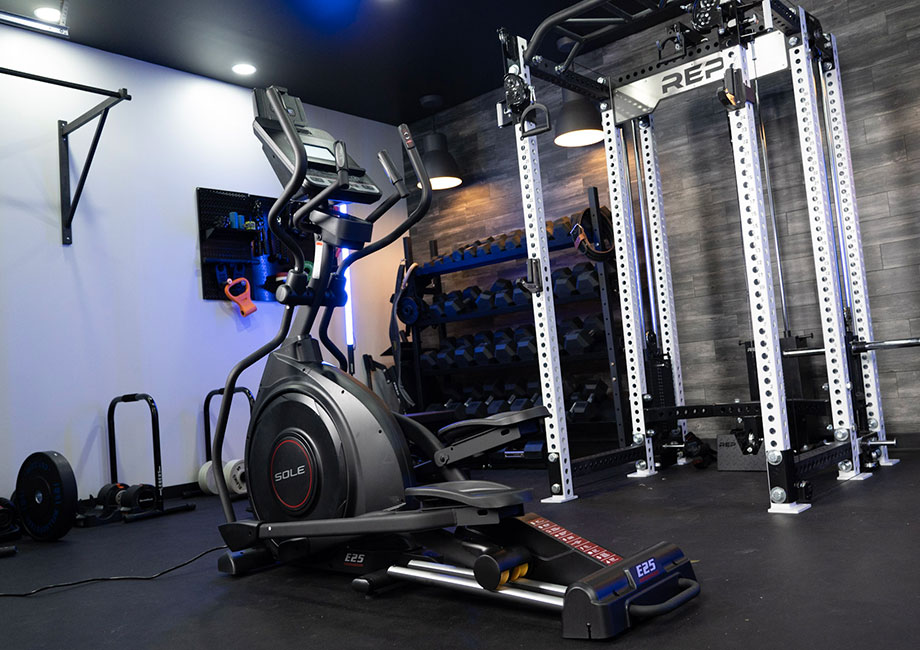 A Sole E25 Elliptical sits in the gym