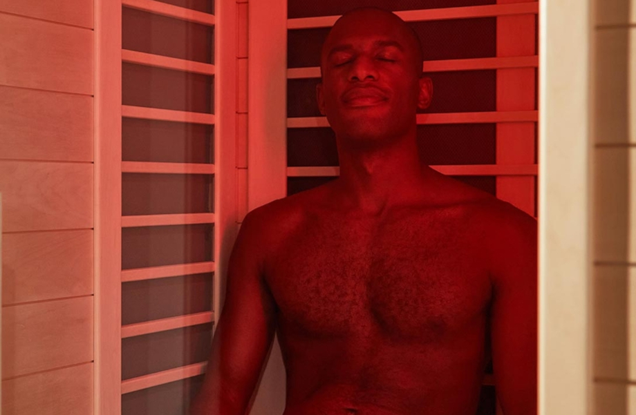 A man sitting in the Sunlighten Amplify II sauna.