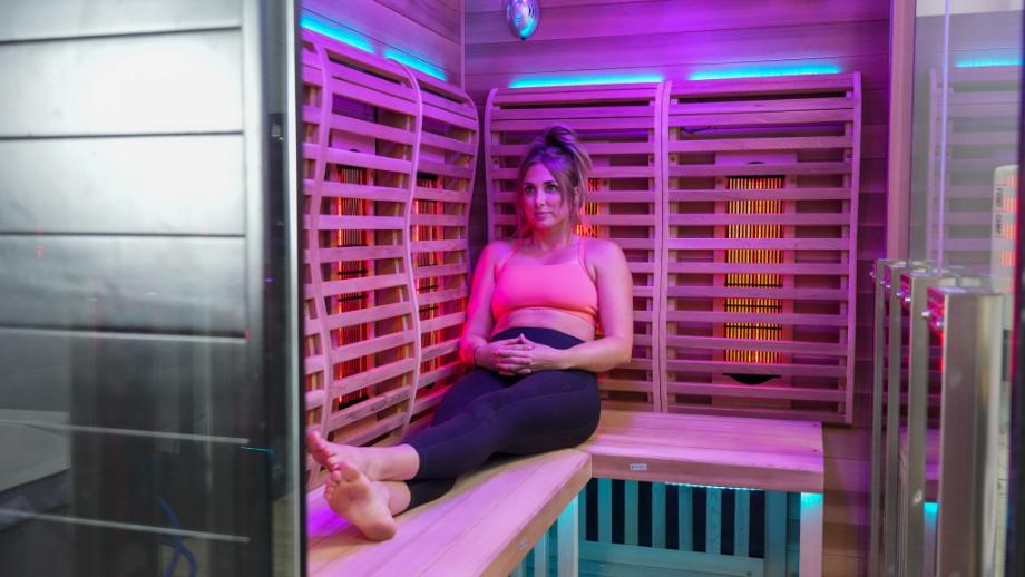 Woman sitting in the Sun Home Infrared Sauna for Infrared sauna dangers article