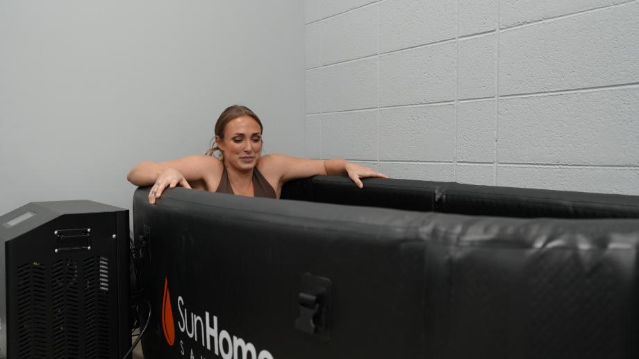 Woman with arms out Sun Home Cold Plunge