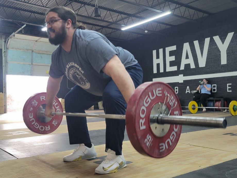 Olympian Caine Wilkes does a snatch while wearing the Nike Salaveos weightlifting shoes.