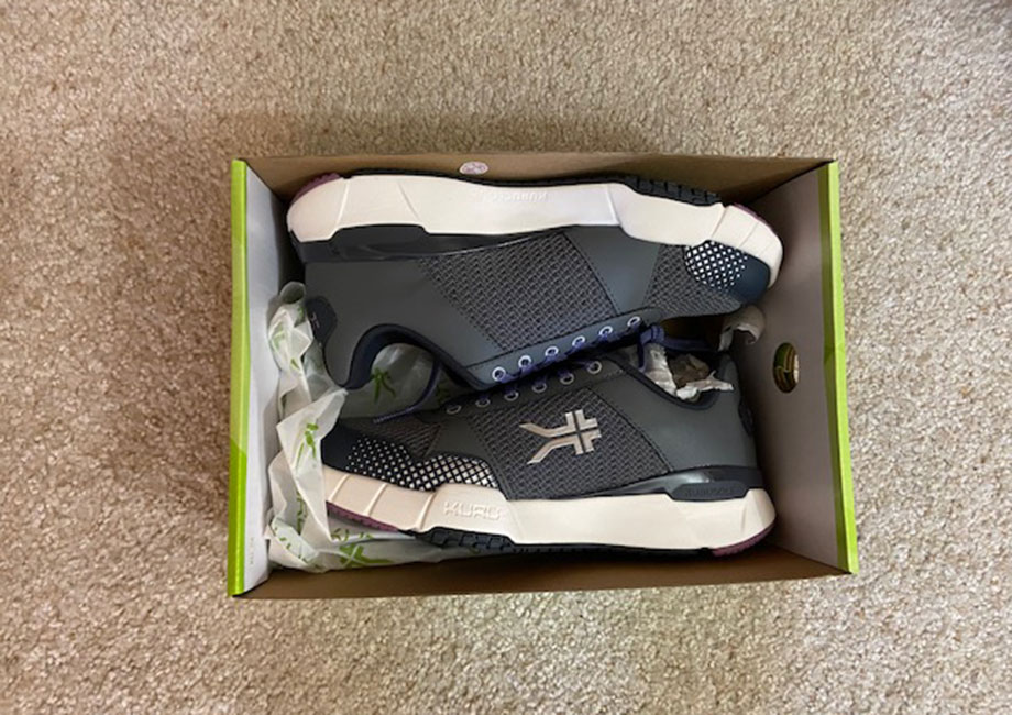 Looking down into a shoebox containing a new pair of KURU QUANTUM 2.0 shoes..