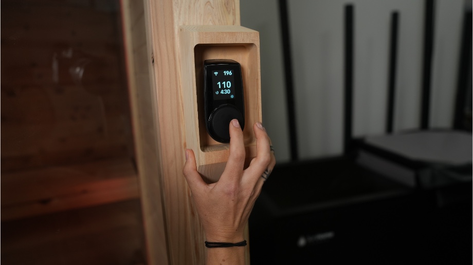 Adjusting the temp controls on the Plunge Sauna.