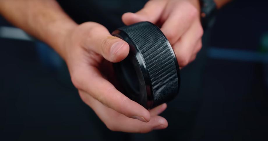 Coop inspects a pair of Titan TwistLock Barbell Collars.
