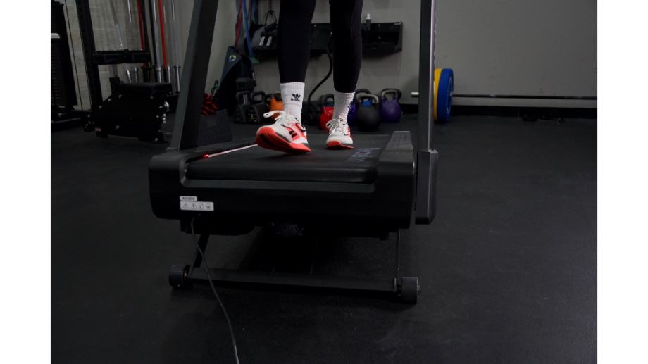 Close up shot of person walking at an incline on Echelon Stride 8s