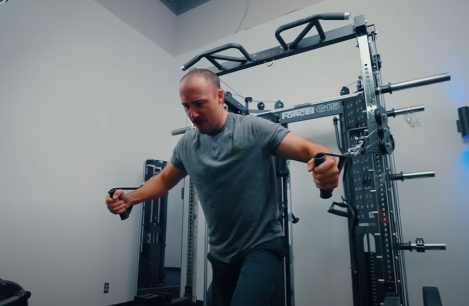 Man doing chest fly on Force USA G15